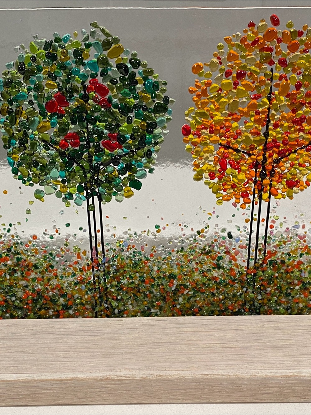 Artisan “Four Seasons" Fused Glass Panel displayed in a slotted wood bas